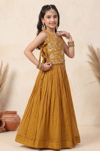 Girl's Brown Silk Blend Embroidered Sleeveless Top Style Choli with Side Knot and Flared Lehenga For Traditional Look