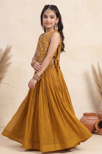Girl's Brown Silk Blend Embroidered Sleeveless Top Style Choli with Side Knot and Flared Lehenga For Traditional Look
